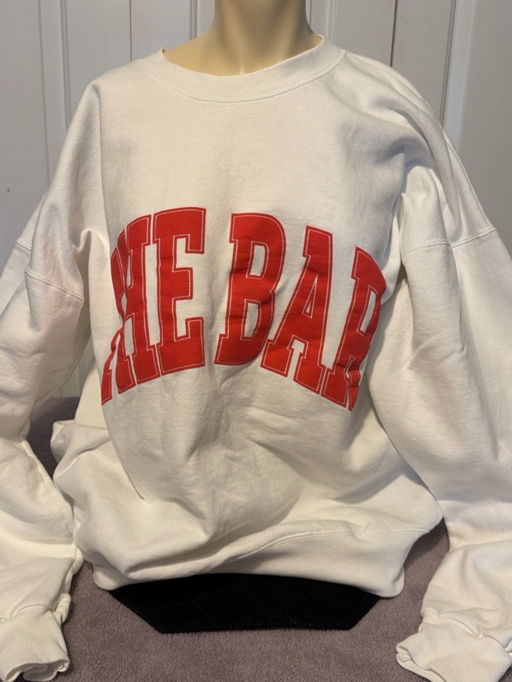 The Bar White Crewneck Sweatshirt with Red Arch Logo